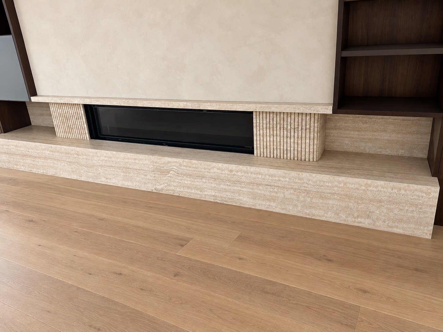 Fluted stone fireplace