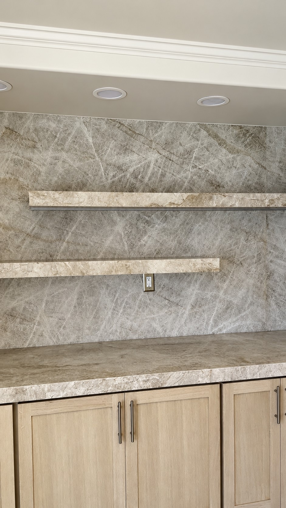 Stone wall and floating shelves